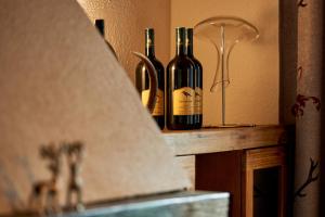 two bottles of wine sitting on top of a counter at Seminar- und Gästehaus im Kloster Bezau in Bezau +14 photos