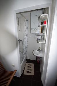 a small bathroom with a sink and a toilet at Jazzy Apartment Zagreb in Zagreb