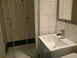 a bathroom with a sink and a shower at Hotel Holländischer Hof in Lich +44 photos