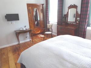 Posteľ alebo postele v izbe v ubytovaní B&B Fiddler's Inn