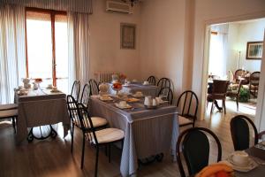 a dining room with tables and chairs in a room at B&B Alle Querce in San Giovanni Rotondo +28 photos