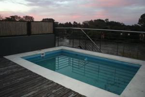 a swimming pool on top of a deck at Paseo Victorica in Tigre