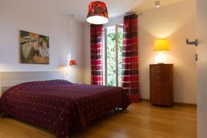 A bed or beds in a room at Guest House Le Acacie