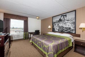 Voodi või voodid majutusasutuse Super 8 by Wyndham Edson toas