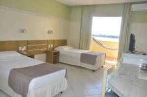 Postel nebo postele na pokoji v ubytování Grande Hotel de Juazeiro