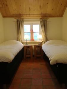 เตียงในห้องที่ Vakantiehuis Ganderhoeve