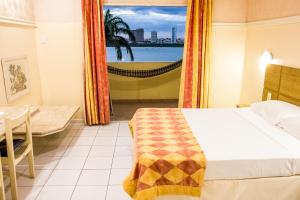 Postel nebo postele na pokoji v ubytování Grande Hotel de Juazeiro