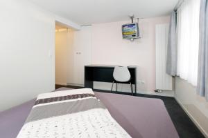 Voodi või voodid majutusasutuse Hotel Krone toas
