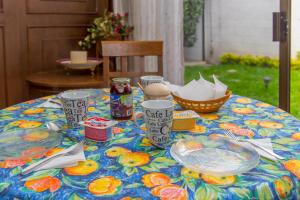 a table with plates of food on top of it at Colibrí B&B in Mexico City