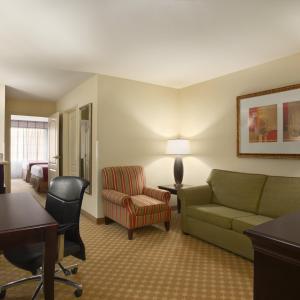 a living room with a couch and a chair at Spark by Hilton Washington Meadowlands Blvd in Washington