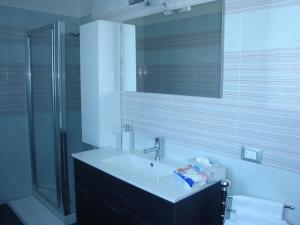 a bathroom with a sink and a mirror at Alloggio al Naviglio in Copparo