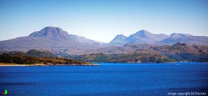 a large body of water with mountains in the background at Muldoanich in Gairloch