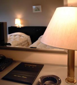 Postel nebo postele na pokoji v ubytování Hotel Silk Inn Madarao