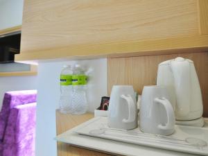 MaxoneHotels.com at Kramat tesisinde mutfak veya mini mutfak