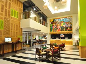 MaxoneHotels.com at Kramat tesisinde bir restoran veya yemek mekanı