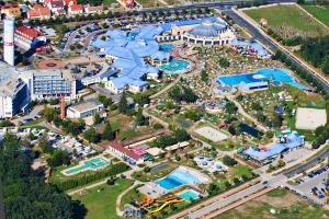 an aerial view of an amusement park with a pool at Cherry Apartmanház in Sárvár