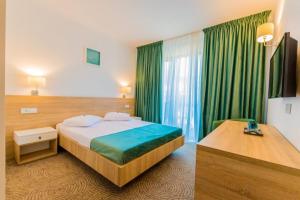 Ένα ή περισσότερα κρεβάτια σε δωμάτιο στο Hotel DADA Termal