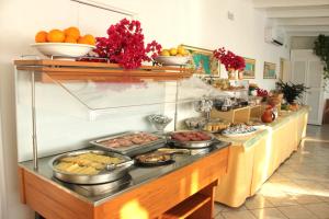 a buffet line with many different types of food at Hotel Ossidiana Stromboli Center in Stromboli