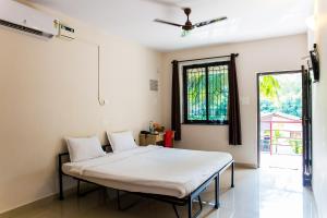 Ein Bett oder Betten in einem Zimmer der Unterkunft Lazy Frog Guest House