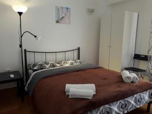A bed or beds in a room at Sfiggos 54 Guest House