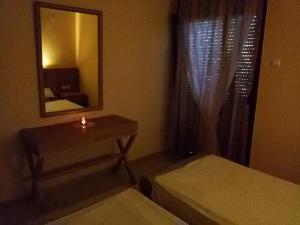 A bed or beds in a room at Villa Maria Apartments