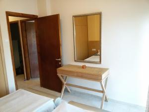 A bed or beds in a room at Villa Maria Apartments