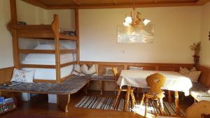 a room with a dining table and a bunk bed at Weberhof in Trins