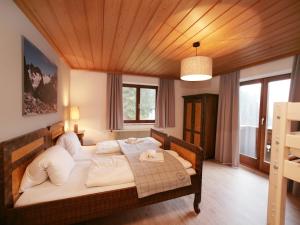 a bedroom with a large bed in a room at Andrea in Leogang