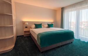 Postel nebo postele na pokoji v ubytování Hotel Schelf GmbH & Co. KG
