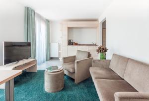 TV a/nebo společenská místnost v ubytování Hotel Schelf GmbH & Co. KG