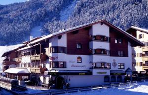 a large building in front of a mountain at Hotel Brennerspitz in Neustift im Stubaital