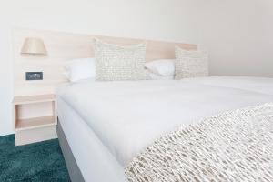 Postel nebo postele na pokoji v ubytování Hotel Schelf GmbH & Co. KG