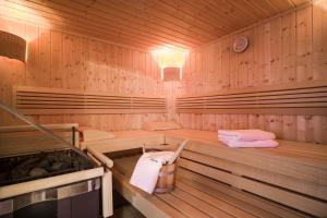 a wooden sauna with two towels in it at Haus Carolin in Westendorf