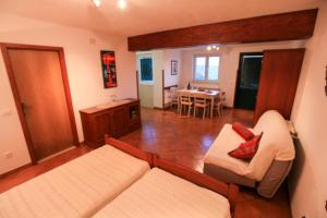 a living room with a couch and a table at Villa Maja in Supetar