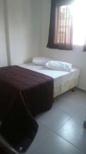 Кровать или кровати в номере Hotel Santos Reis