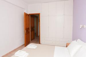Postel nebo postele na pokoji v ubytování Kolios Seaside Apartments