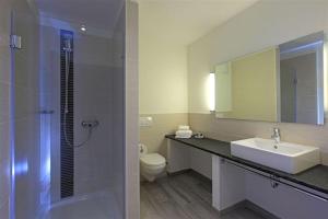 Koupelna v ubytování Hotel Schelf GmbH & Co. KG
