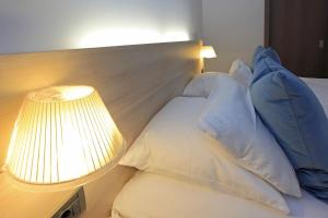 Postel nebo postele na pokoji v ubytování Hotel Schelf GmbH & Co. KG