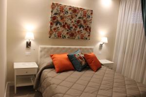 מיטה או מיטות בחדר ב-CASA GRAMSCI B&B