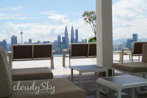 a room with chairs and a view of the city at Sentrio Pandan Kuala Lumpur in Kuala Lumpur