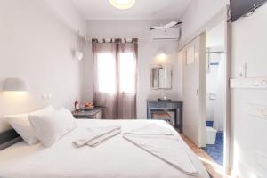 Ein Bett oder Betten in einem Zimmer der Unterkunft Madaky Hotel