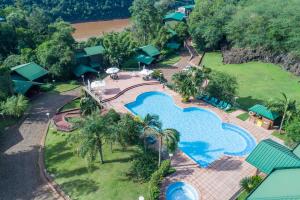 an aerial view of a swimming pool at a resort at Iguazu Jungle Lodge in Puerto Iguazú