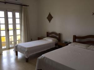 Postel nebo postele na pokoji v ubytování Hotel Lazer Piata