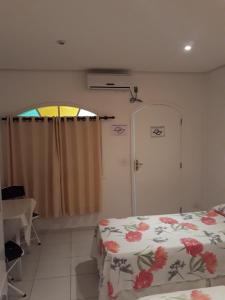 Ein Bett oder Betten in einem Zimmer der Unterkunft Pousada da Barra