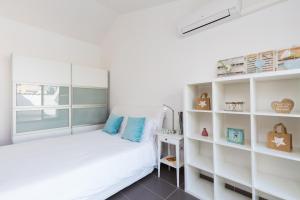 Postel nebo postele na pokoji v ubytování Apartamentos Cornellalux