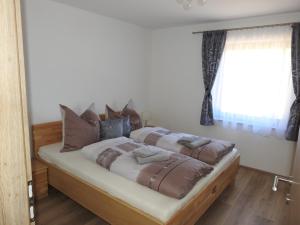 Postel nebo postele na pokoji v ubytování Ferienhaus Kristabauer