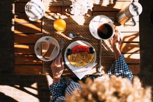 a person sitting at a table with a plate of food at Riad Anata in Fez