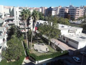 an aerial view of a city with palm trees and buildings at Le Tre Civette in Sassari