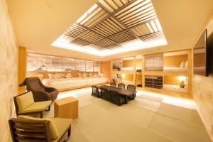 a living room filled with furniture and a large window at The Centurion Classic Akasaka in Tokyo
