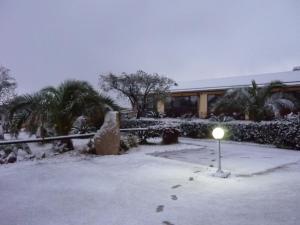 a light in the snow in front of a building at Agriturismo Isidoro in Fertilia